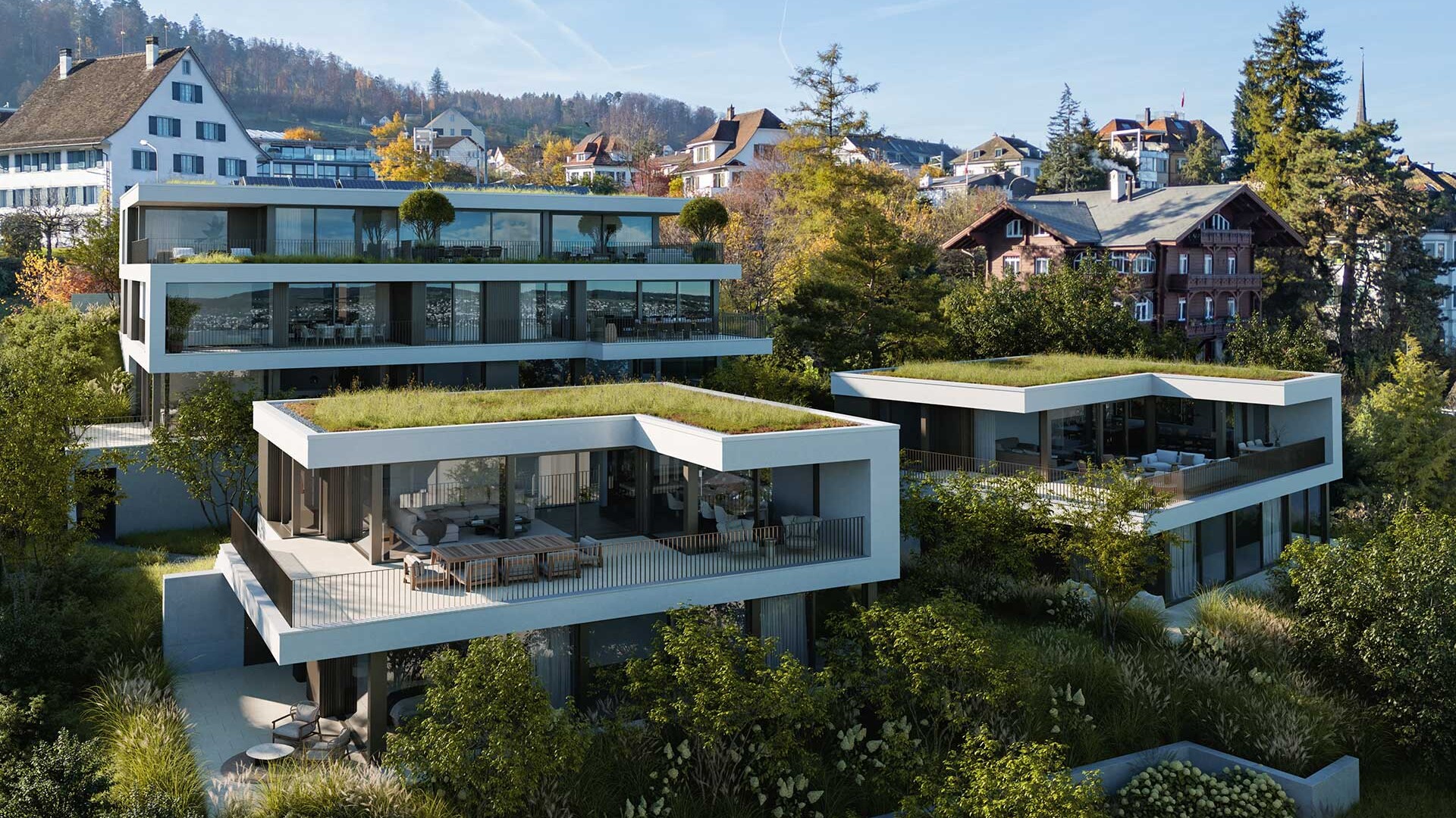Sicht auf die modernen Terrassen der Liegenschaft BELAIR in Oberrieden mit Sicht auf das Dorf im Hintergrund