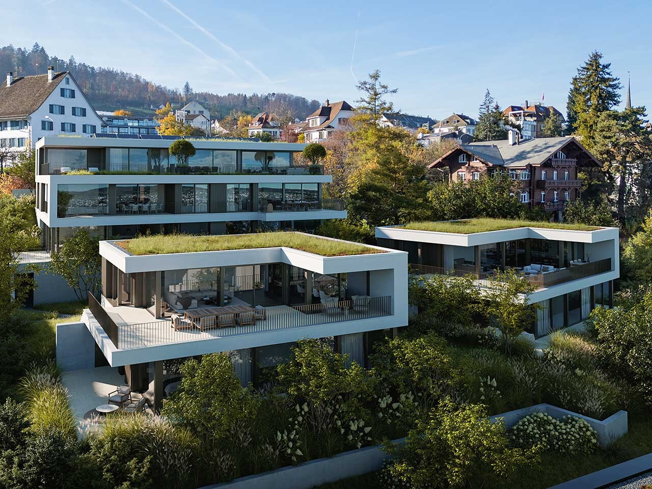 Sicht auf die modernen Terrassen der Liegenschaft BELAIR in Oberrieden mit Sicht auf das Dorf im Hintergrund