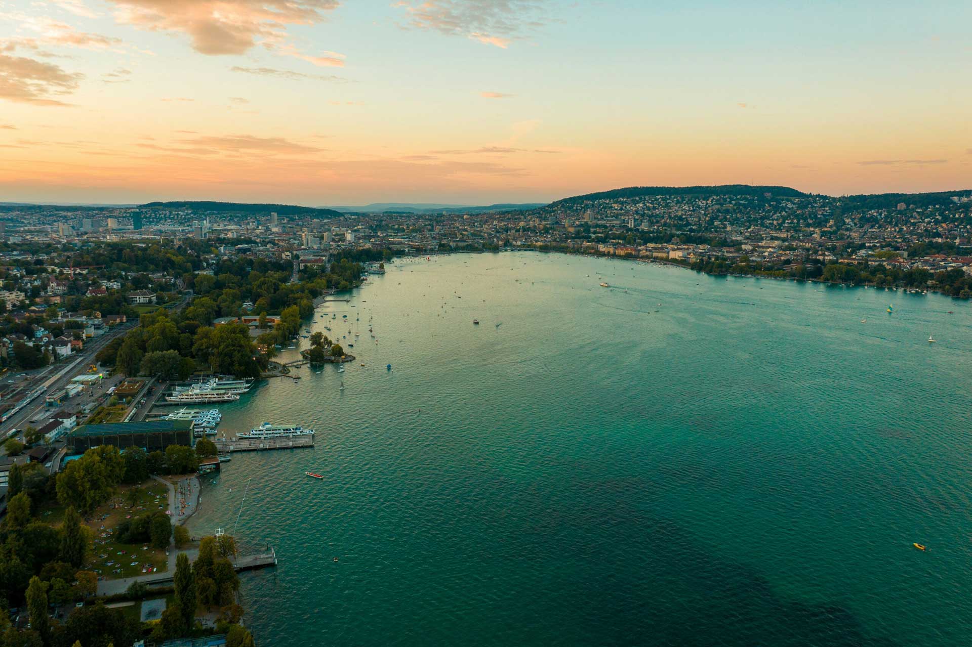Aerial view of Lake Zurich, at the level of Wollishofen looking towards the city of Zurich at sunset