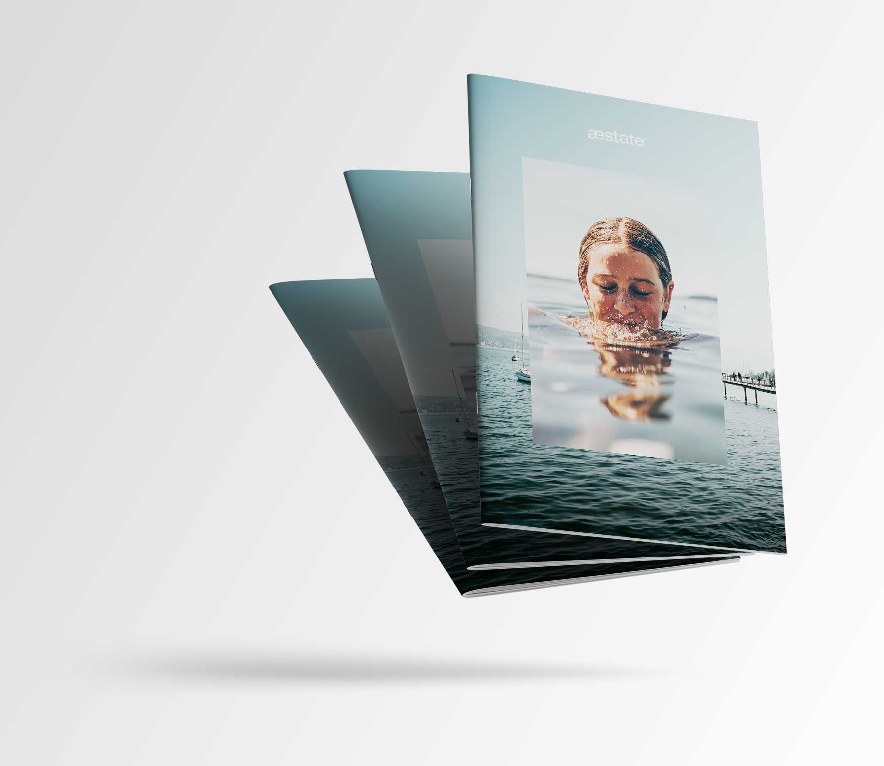 Mockup of the new real estate brochures from aestate development ag